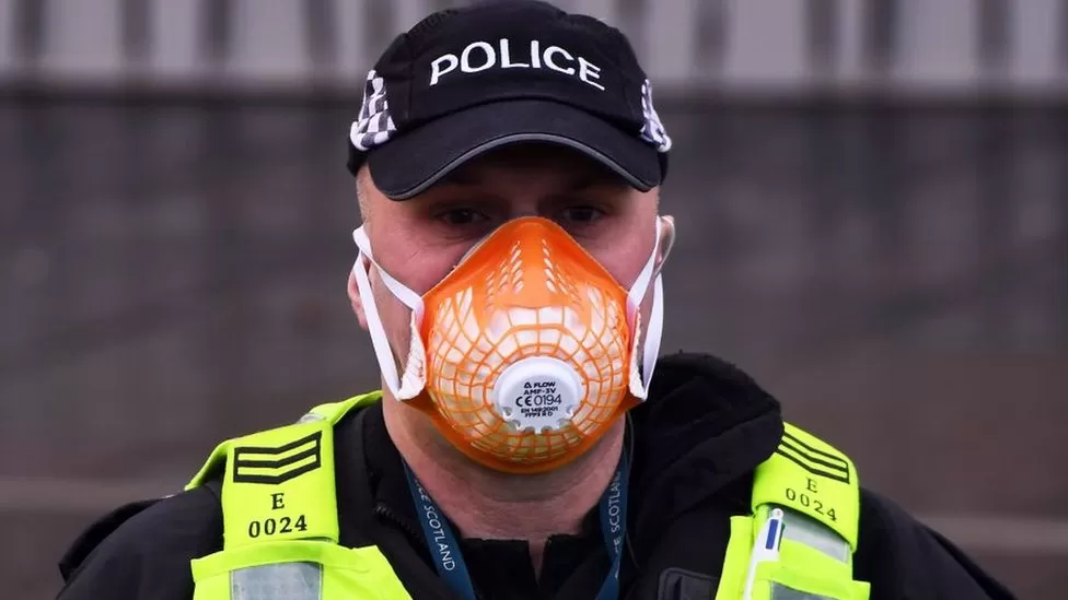 Police officer in face mask